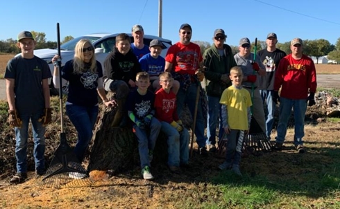 Helpers on the east side of the Arboretum using new tree chair 490